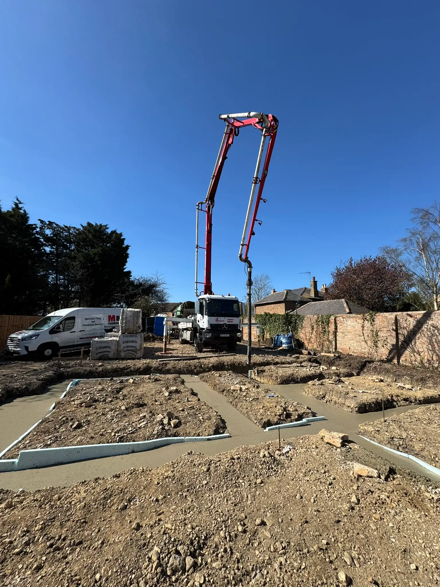 Concrete pump on a new build foundation pour